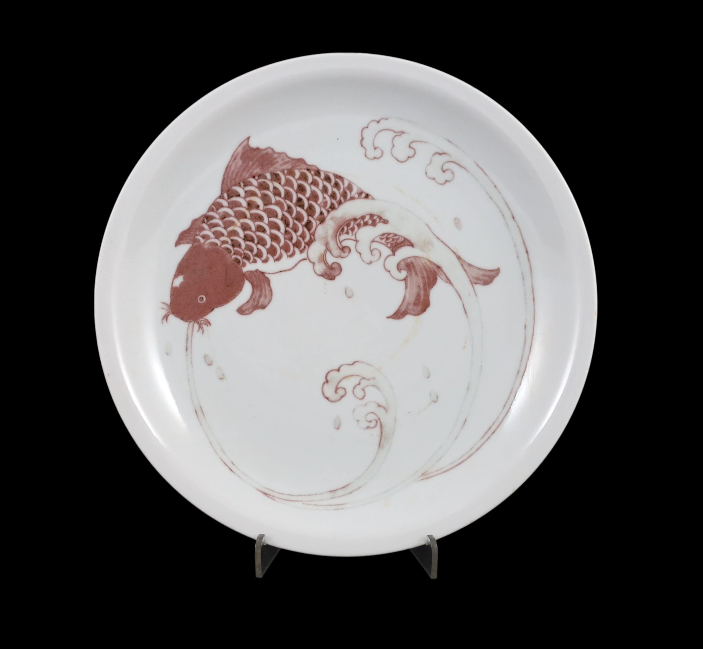 A Chinese iron-red underglaze plate, 25.5 cms diameter.